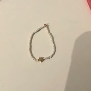 This bracelet is blue and tan about 4 to 5 inches long. Hope you enjoy.